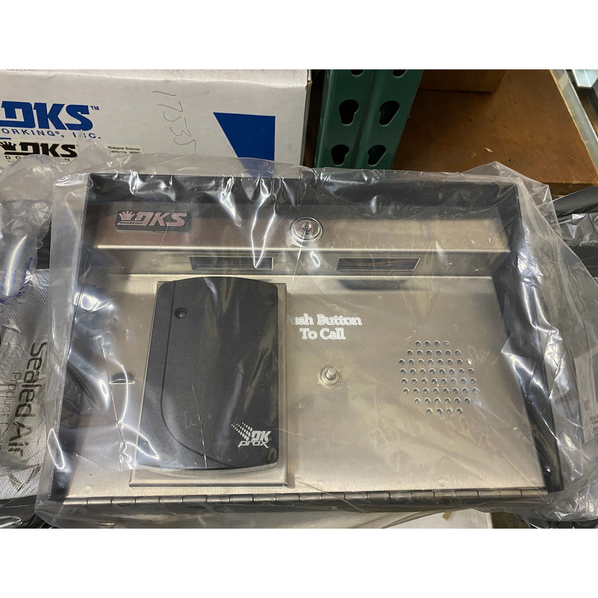 DoorKing 1504-124 DKS Prox Card Reader with Intercom, shown in its wrapper